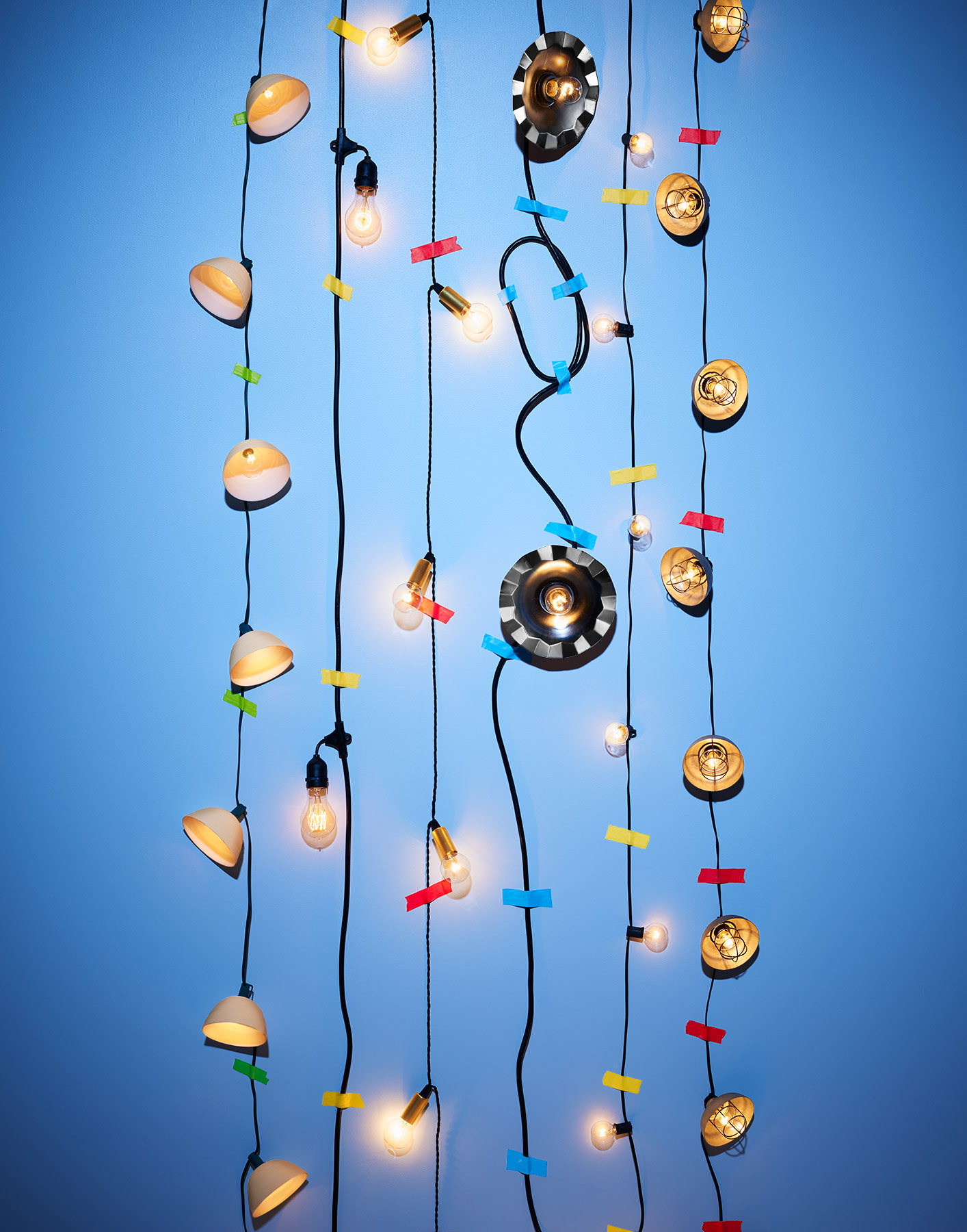 A composition of string lights on blue by Ted Cavanaugh
